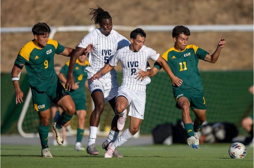 #9 Kevin Sanchez and #11 Jonathan Moreno battle against IVC to gain possession